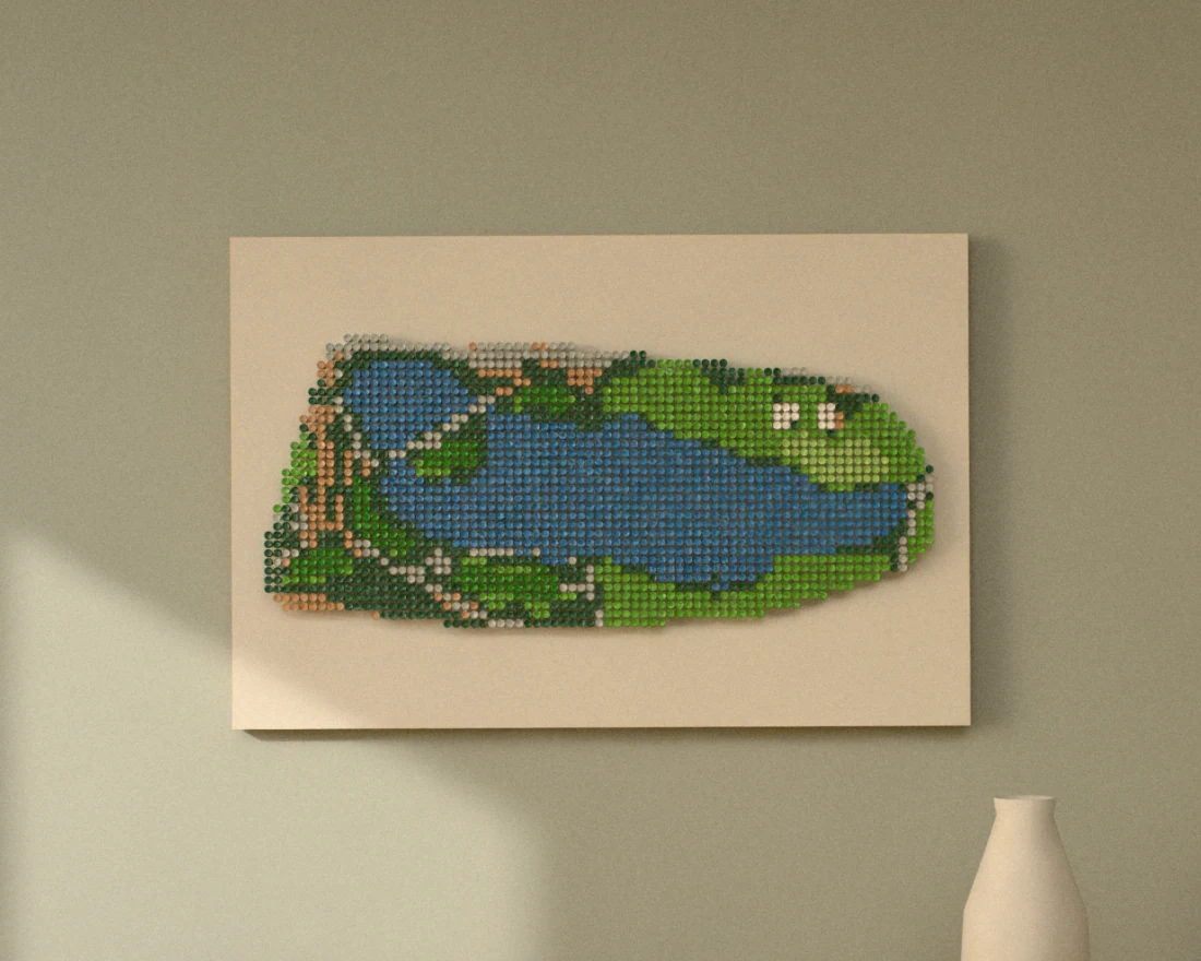 A golf-tee picture of a par 3 played over a long lake, hung wide on a sage wall above a wooden sideboard with books and a vase.